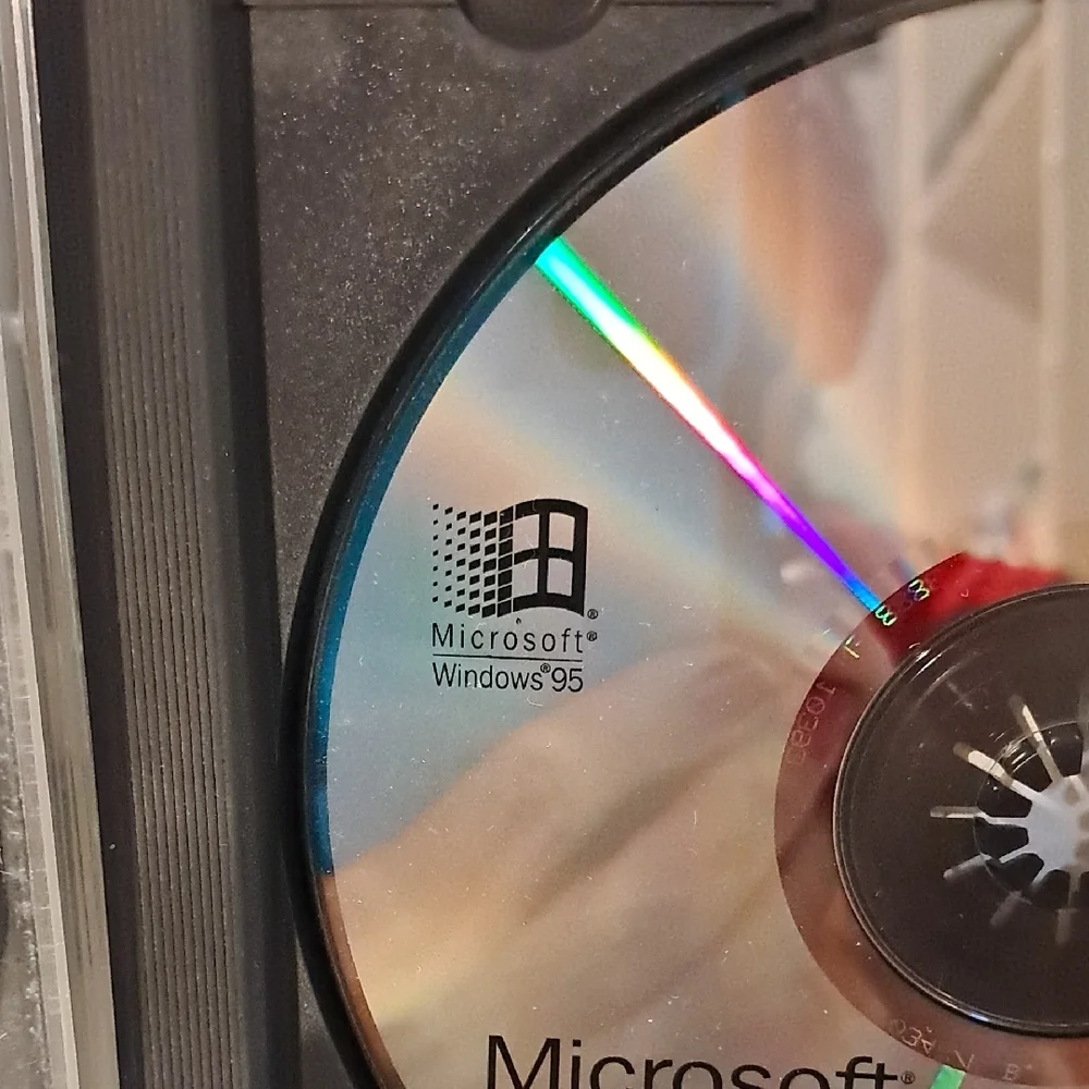 Microsoft Windows 95 and Office CD Set - Silver, Black, and Blue